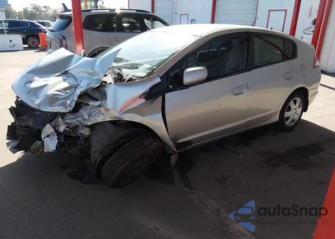 2010 Honda Insight Lx z USA, uszkodzony, nr VIN JHMZE2H55AS031608